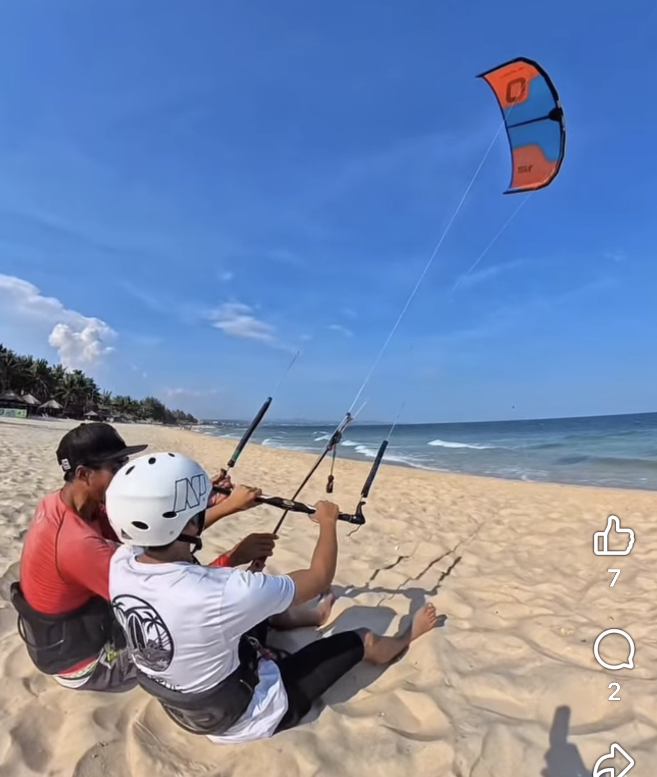 Beginner flying a trainer kite with Lý on Ham Tien beach