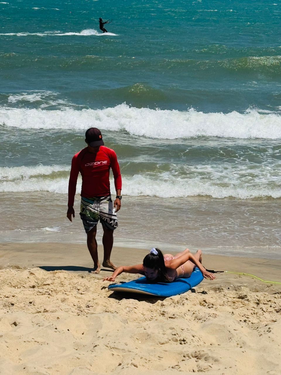 Surf lesson pop-up practice on the sand in Mui Ne