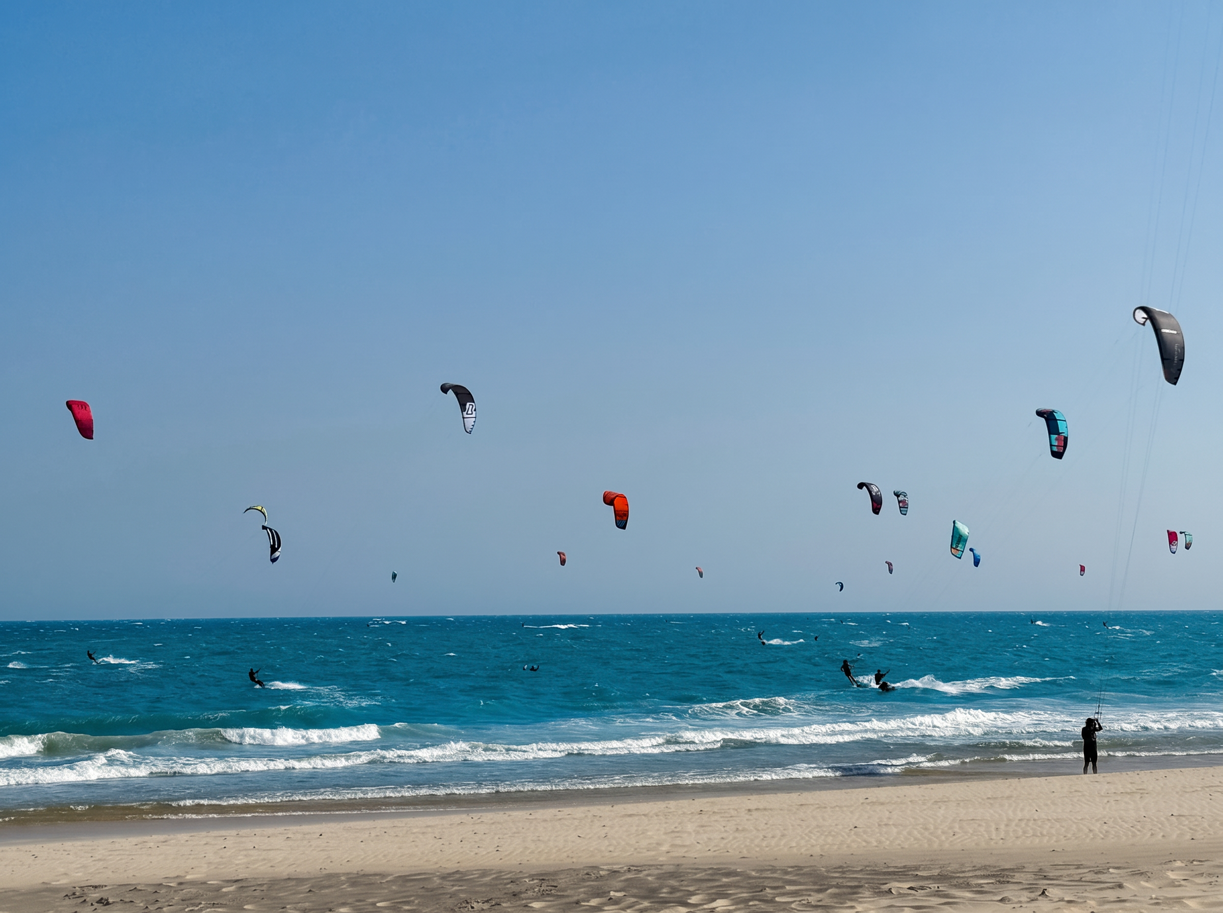 Kitesurfer riding at sunset off Ham Tien beach in Mui Ne, Vietnam